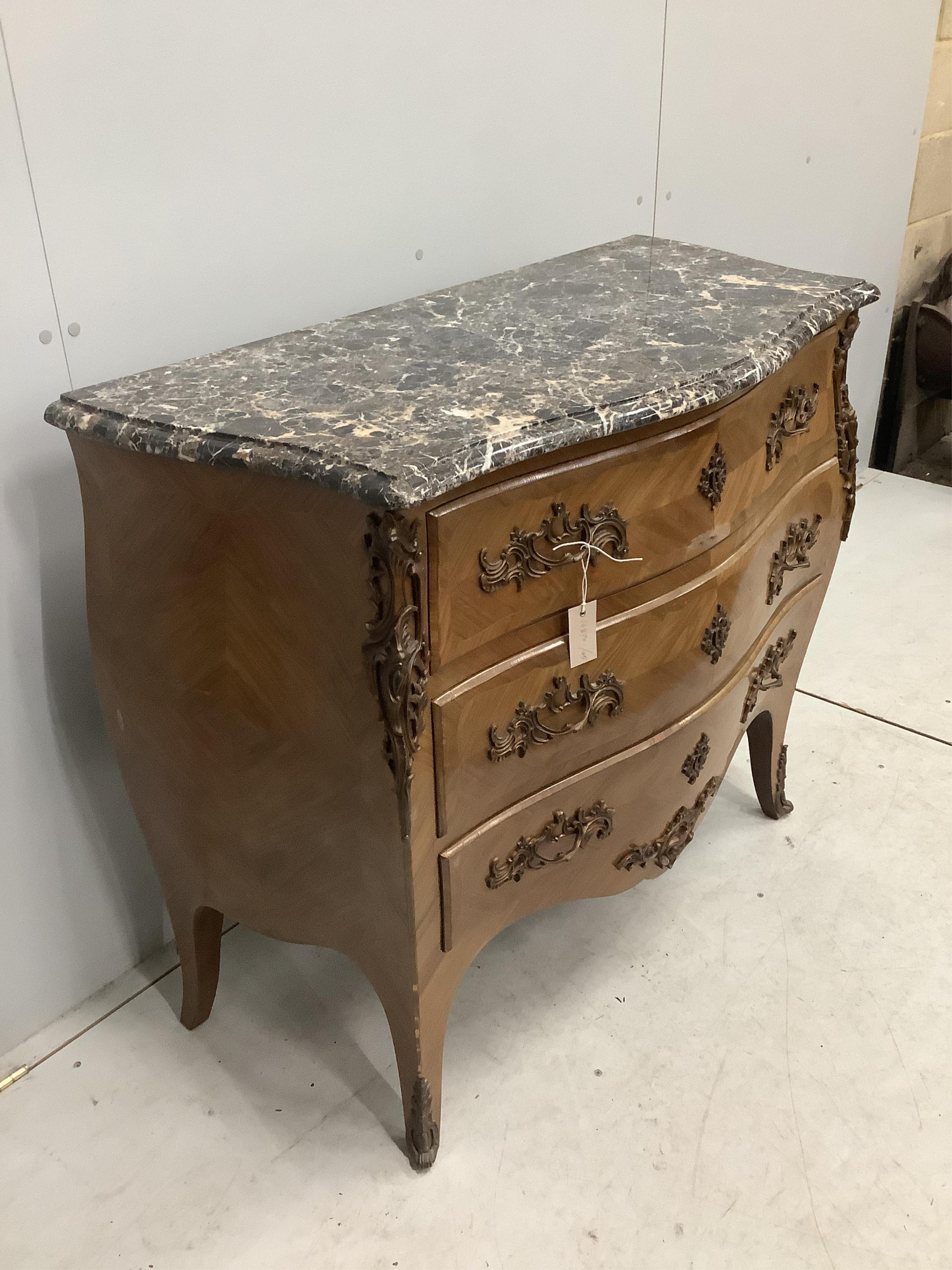 A Louis XV style gilt metal mounted marble top bombe commode, width 105cm, depth 49cm, height 89cm. Condition - fair